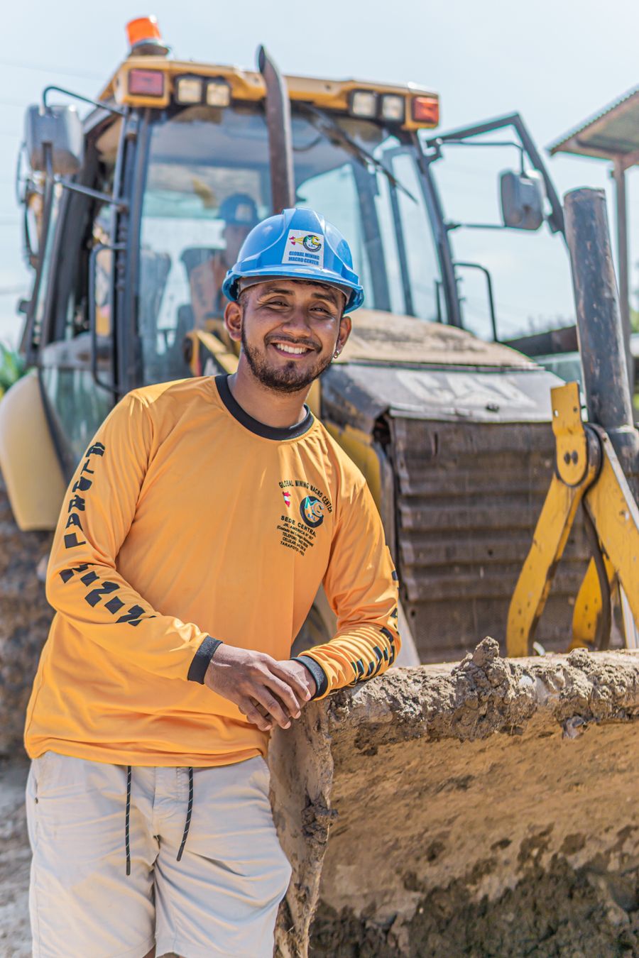 A smiling construction worker in a hard hat